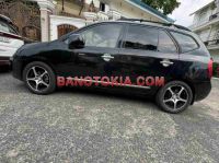 Cần bán gấp Kia Carens SX 2.0 AT đời 2010, màu Đen
